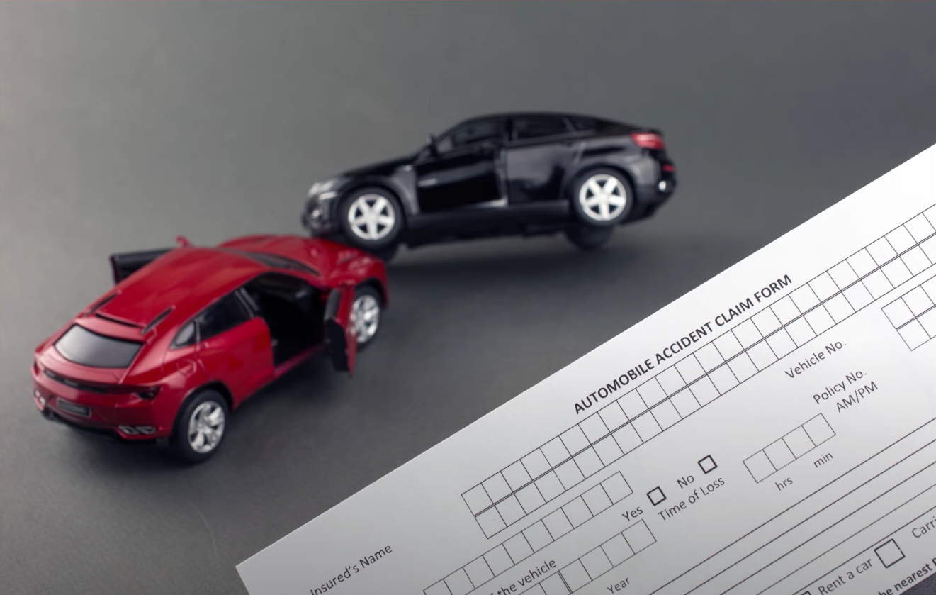 A person comparing auto insurance quotes on a laptop, highlighting key factors to consider.